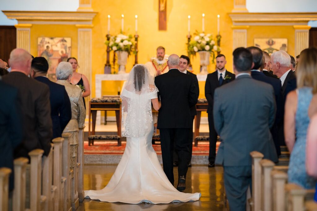 bride's father walks her down the aisle at a church in stonington ct