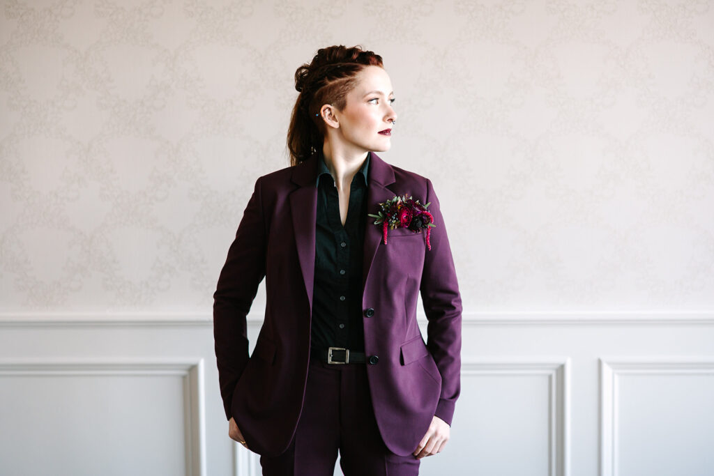 A woman in a purple suit.
